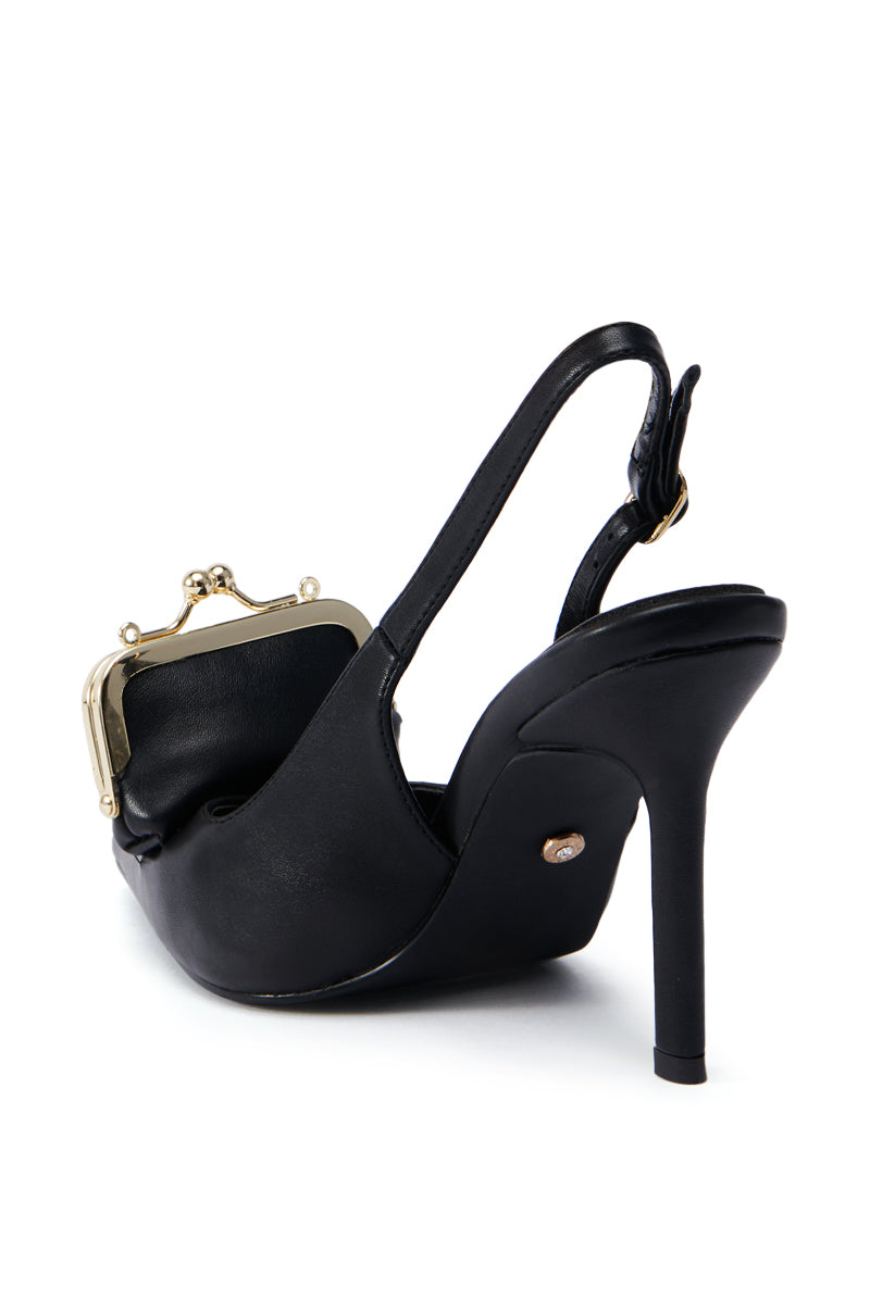 The AZALEA WANG BAYLOR BLACK STILETTO PUMP is a chic black high-heeled stiletto with an open back, crafted from sleek faux leather. It features a pointed toe and includes an integrated small, gold-framed purse in place of the heel counter, seamlessly blending fashion with functionality in its unique design.