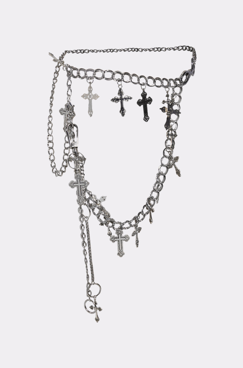 The ULTIMATE CROSS CHAIN BELT features silver chains with dangling cross pendants in assorted styles and sizes, perfect for adding festival flair. Shown elegantly against a plain white background.