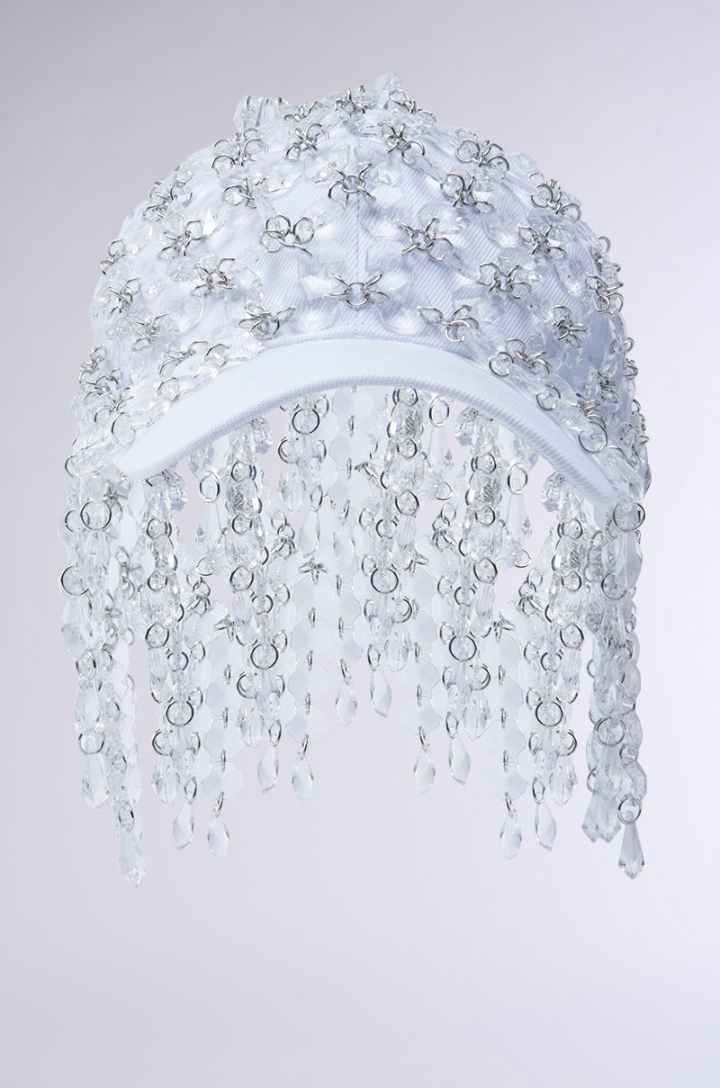The IN THE CLEAR BEADED HAT is embellished with silver beads, crystals, gemstone accents, and beaded fringe that hangs from the brim for a sparkling, decorative look.