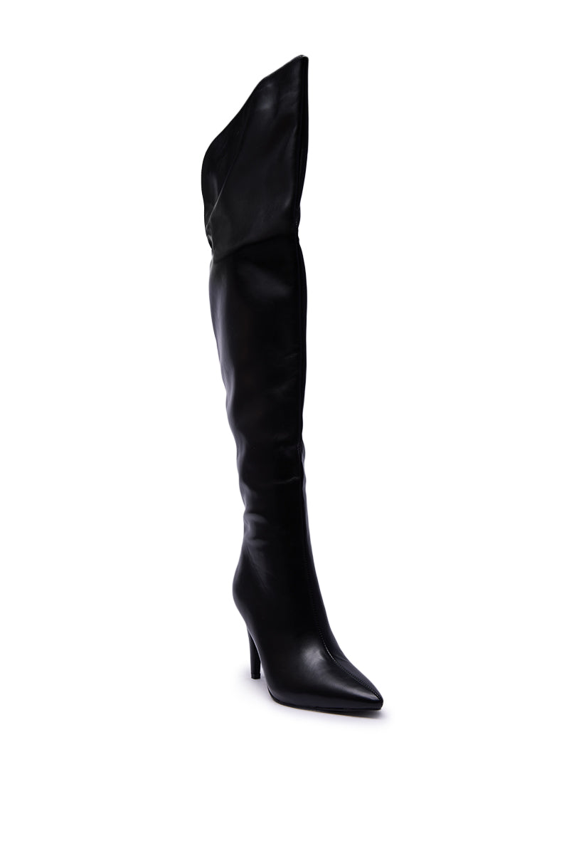 The AZALEA WANG BEAUCOUP BLACK OVER THE KNEE BOOT, featuring faux leather, a pointed toe, slouchy shaft, and slim stiletto heel, is shown against a plain white background.