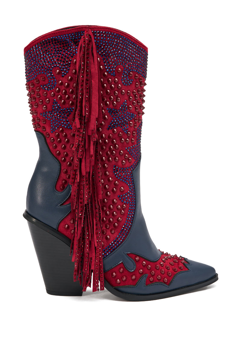 The AZALEA WANG BETHANIE MULTI RHINESTONE FRINGE WESTERN BOOTIE features a blue base, red suede accents, blue and red studs, bold rhinestone fringe on the side, a pointed toe, and a tall angled black heel for standout style.