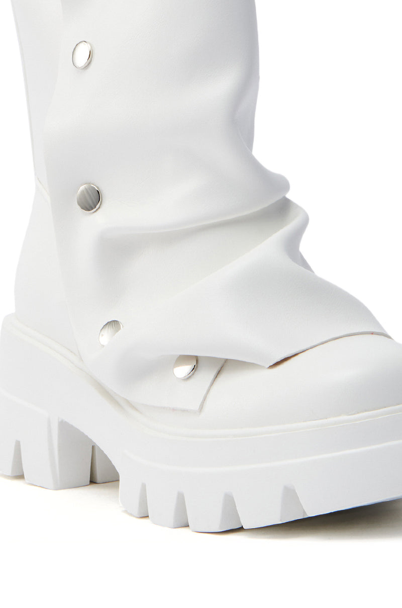 Close-up of the AZALEA WANG BHARTI WHITE SNAP BOOTIE, featuring a white snap detail, chunky sole, and silver buttons. Made from soft vegan leather with a slightly gathered look for a fashionable touch.