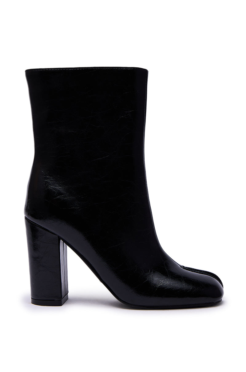 The AZALEA WANG BILHA BLACK SPLIT TOE DETAIL BOOTIE features a black split toe, rounded front, and high chunky heel, shown in side profile against a white background.