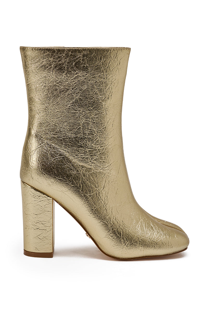 The AZALEA WANG BILHA GOLD SPLIT TOE CHUNKY BOOTIE features a metallic gold finish, high block heel, rounded split toe, and textured crinkled faux leather, shown from the side.