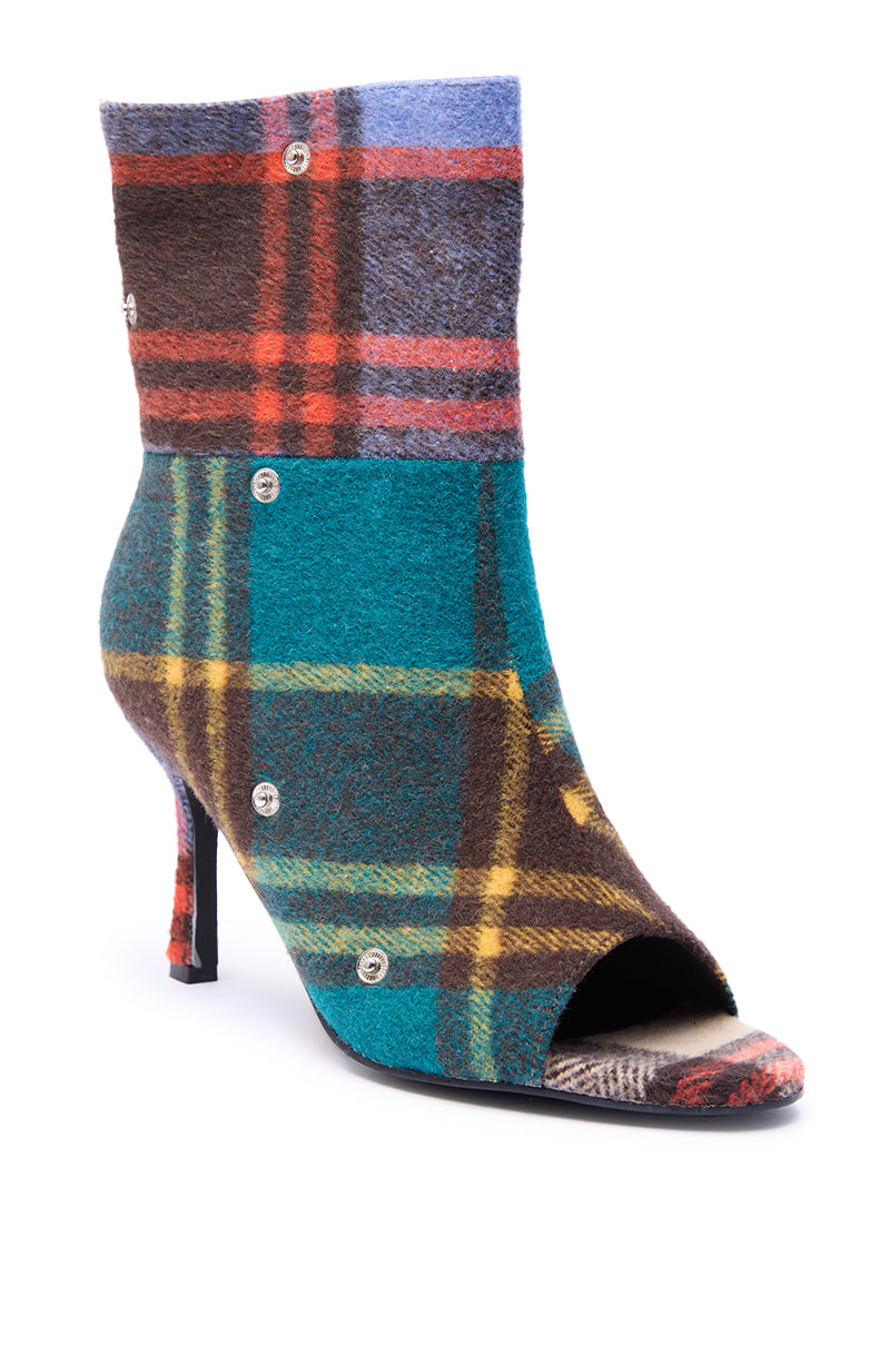 The AZALEA WANG BIRD SONG PLAID MULTI OPEN TOE SNAP BOOTIE features a stiletto heel, round silver buttons, and a vibrant plaid in teal, brown, yellow, and red.