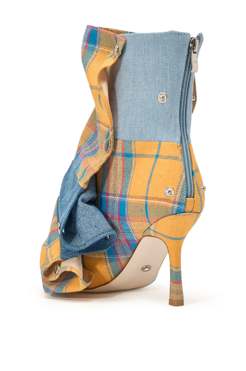 The AZALEA WANG BIRDSONG YELLOW PLAID SNAP BOOTIE is a high-heeled, open-toe stiletto bootie with yellow plaid and light blue denim, featuring a ruched snap panel, zipper closure, and a deconstructed layered look. 4