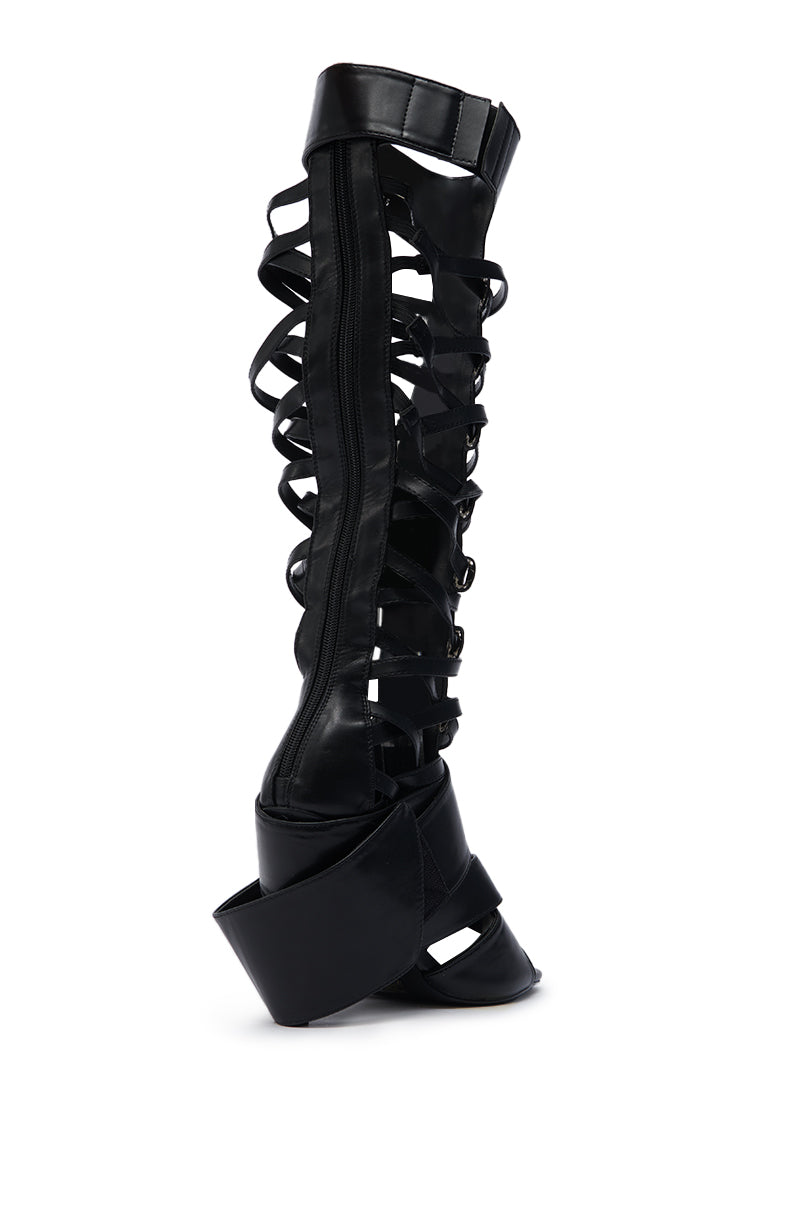 The AZALEA WANG BLACKBIRD BLACK PU STILETTO GLADIATOR SANDAL features multiple crisscross straps, an open toe, and a zip-up back, finished with a striking stiletto heel for a bold, modern look.