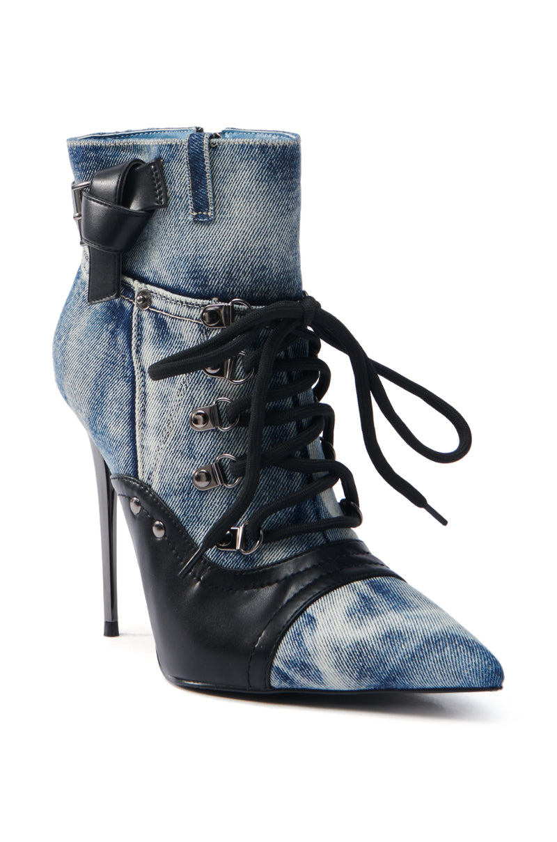 The AZALEA WANG BLANCHE DENIM STILETTO BOOTIE has a pointed toe, ankle-high shaft, lace-up front, side zipper, and a decorative buckle at the top.
