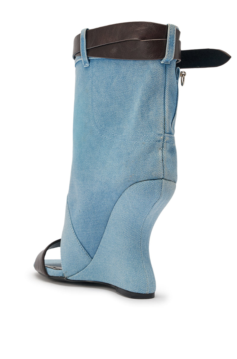 The AKIRA GOLD BLEILIC DENIM WEDGE OPEN TOE BOOTIE is a standout shoe with blue jean fabric, a black strap, and an open toe—designed to resemble denim pants for bold statement style. 5