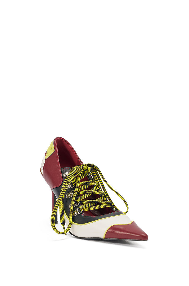 The AZALEA WANG BLITZ MULTI COLOR LACE UP STILETTO PUMP features a pointed toe, bold colorblock stiletto heel in burgundy, white, and black faux leather, accented with neon yellow-green laces threaded through metal eyelets. 3
