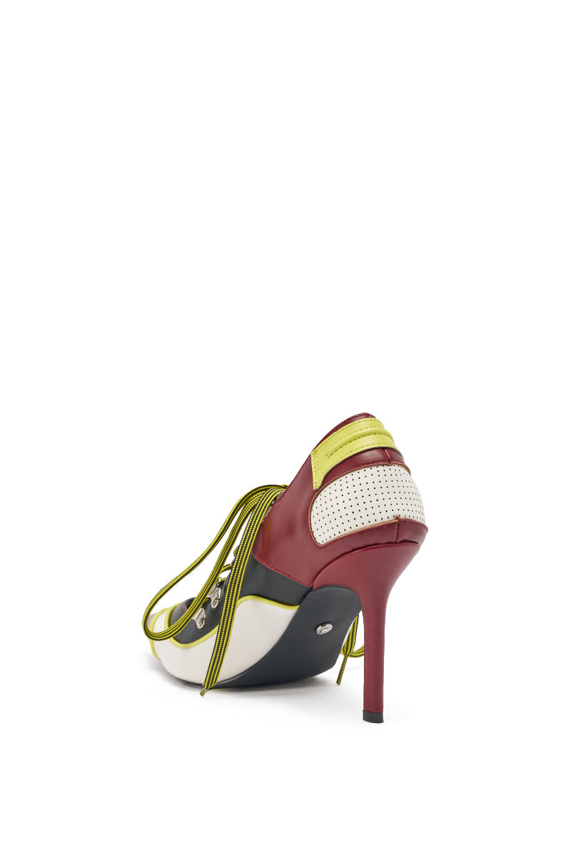 The AZALEA WANG BLITZ MULTI COLOR LACE UP STILETTO PUMP features red, white, yellow, and black colorblock faux leather panels, perforated details, and thin yellow straps for a bold look when viewed from the back. 4