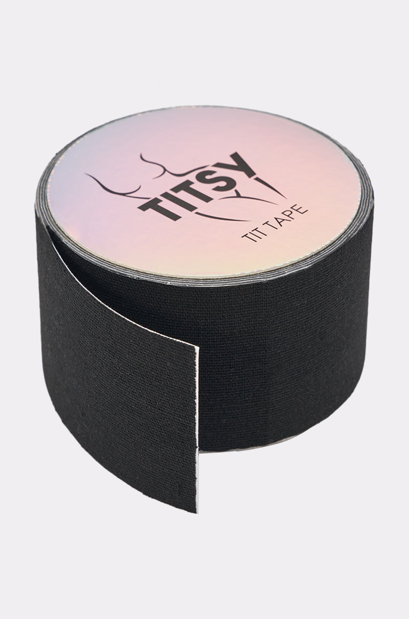 A partially unrolled roll of TITSY ULTRA LIFT BOOB TAPE IN BLACK displays its textured, adhesive side. The packaging features a simple bust outline for this no-show support tape. 0