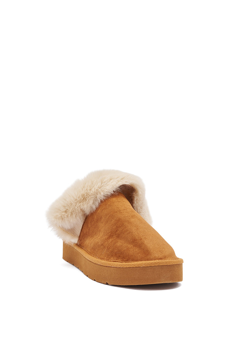 The AKIRA Boone Camel Slipper with Pearls is a tan faux suede slipper with a fluffy cream faux fur lining, shown angled on a white background. 5