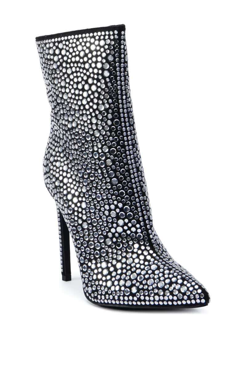 The AZALEA WANG BRAULIO BLACK STILETTO BOOTIE is a high-heeled bootie adorned with sparkling silver sequins and features a pointed toe along with sleek rhinestone embellishments for an elegant design.
