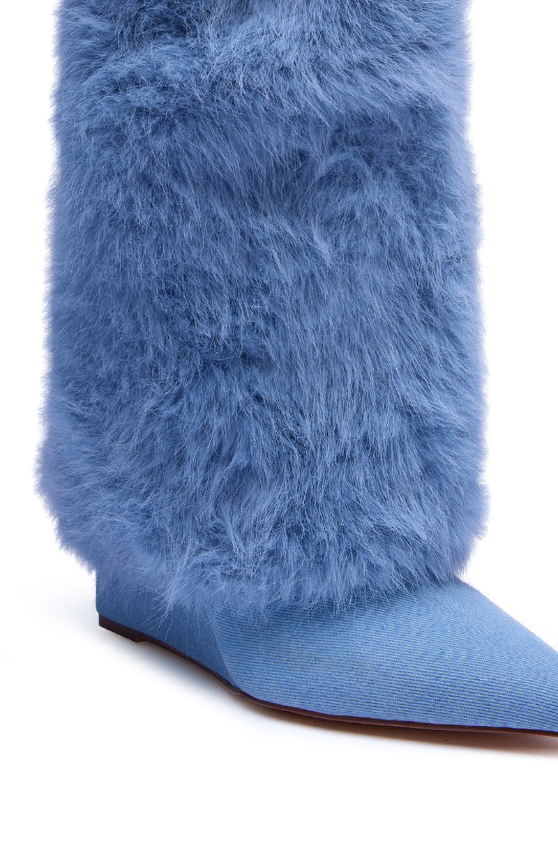 A close-up of the AZALEA WANG BRIASH DENIM FUR HIDDEN WEDGE BOOTIE, featuring a pointed toe and thick, fluffy light blue faux fur over a matching fabric sole.