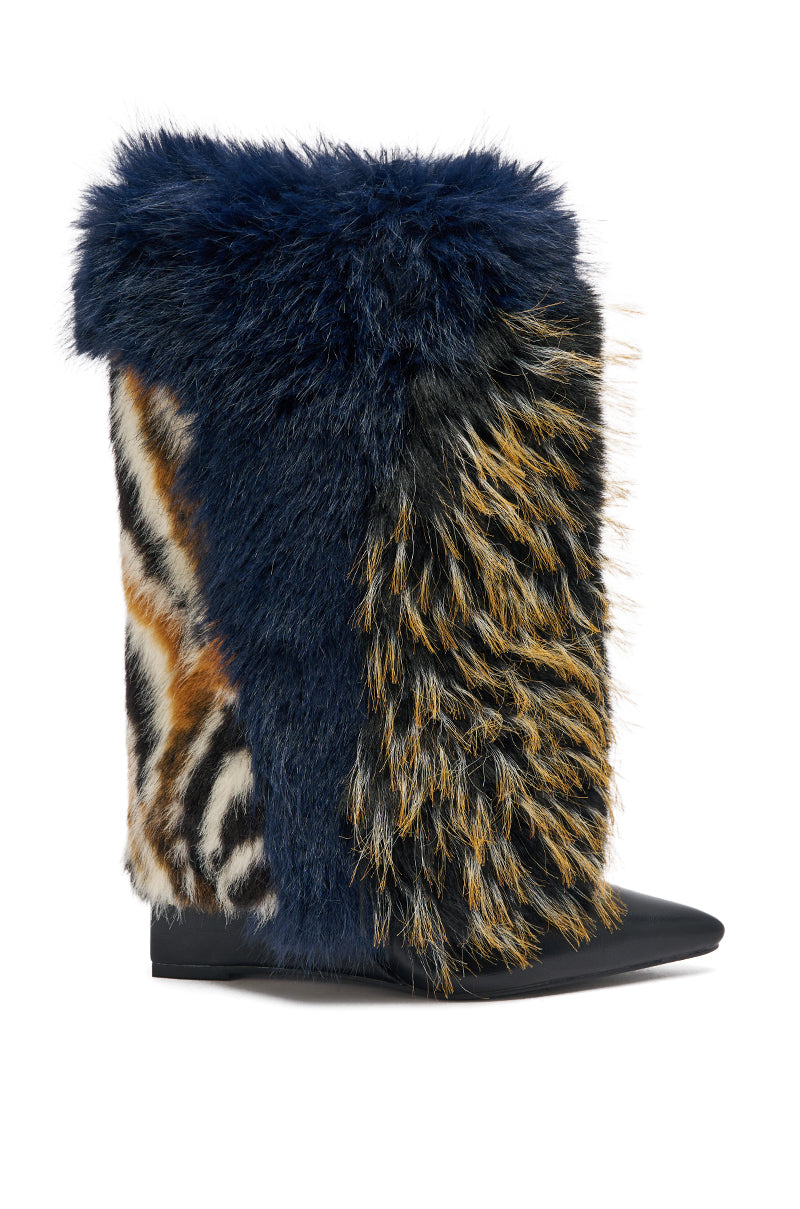 The AZALEA WANG BRIASH NAVY MULTI WEDGE BOOTIE is a striking mid-calf faux fur boot with mixed textures and animal print in navy blue, black, yellow, white, and brown, finished with a pointed black toe for standout style.