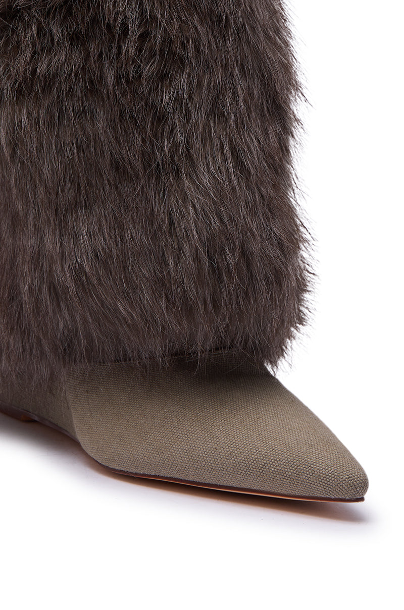 Close-up of the AZALEA WANG BRIASH OLIVE WEDGE FUR BOOTIE—an olive wedge bootie with a pointed toe, covered in olive fabric and topped with thick, dark brown faux fur—your ultimate winter power shoe.