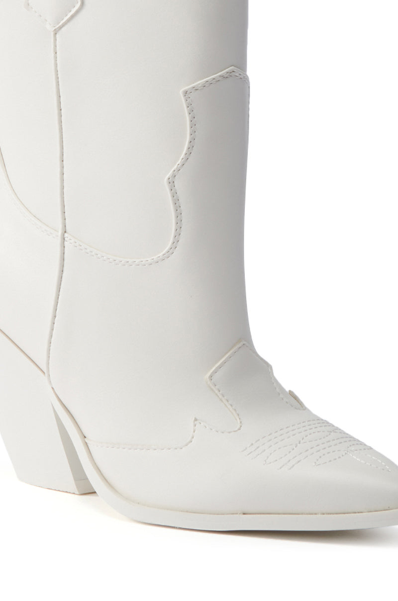 Close-up of the lower part of the AZALEA WANG BRIGGITTA WHITE WESTERN COWBOY BOOTIE, featuring decorative stitching and a pointed toe in faux leather, shown on a white background.