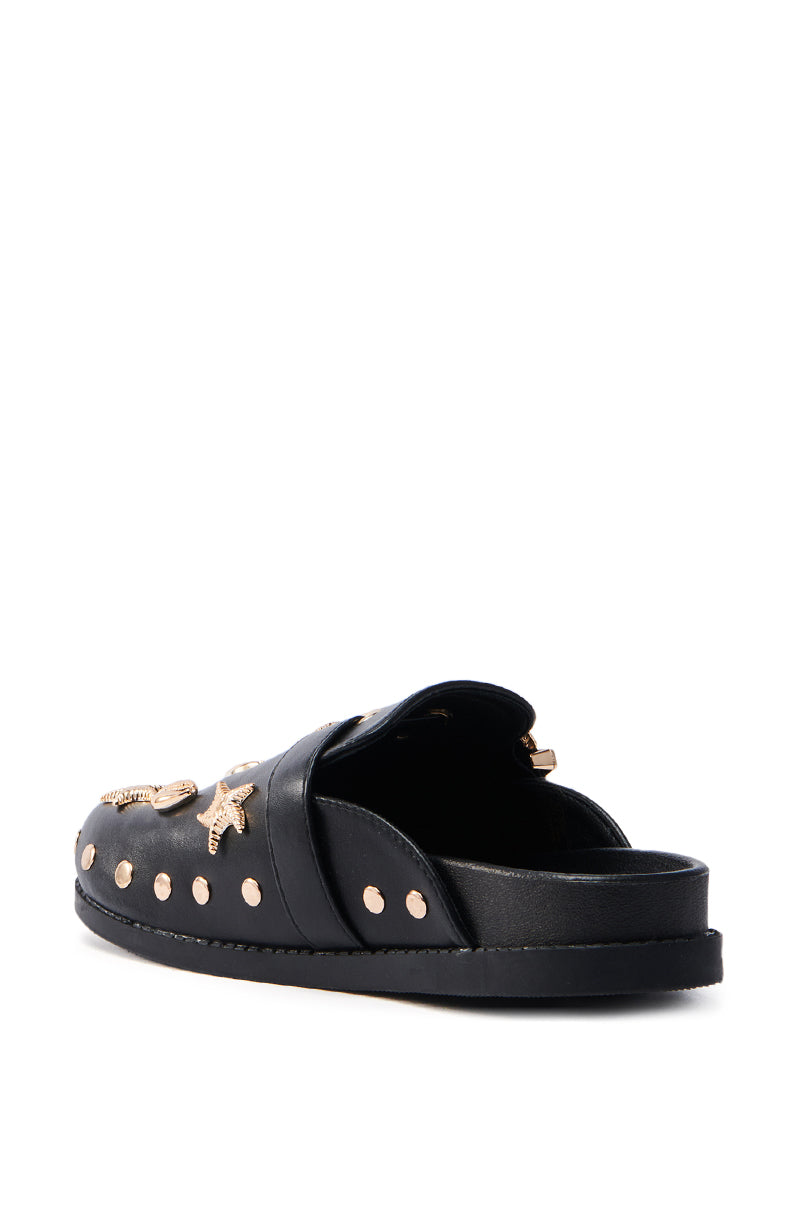 From a back angle on a pristine white background, the AZALEA WANG Briny Black Sea Shell Embellished Clog features gold star embellishments and gold studs along the edge.