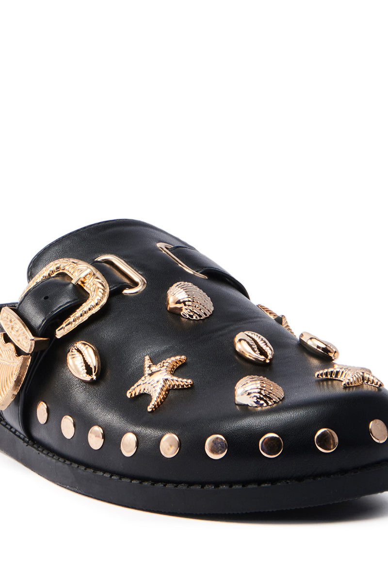 The AZALEA WANG BRINY BLACK SEA SHELL EMBELLISHED CLOG features a black almond toe adorned with vegan leather sea-themed embellishments like starfish and shells, a gold buckle, and gold studs lining the sole.