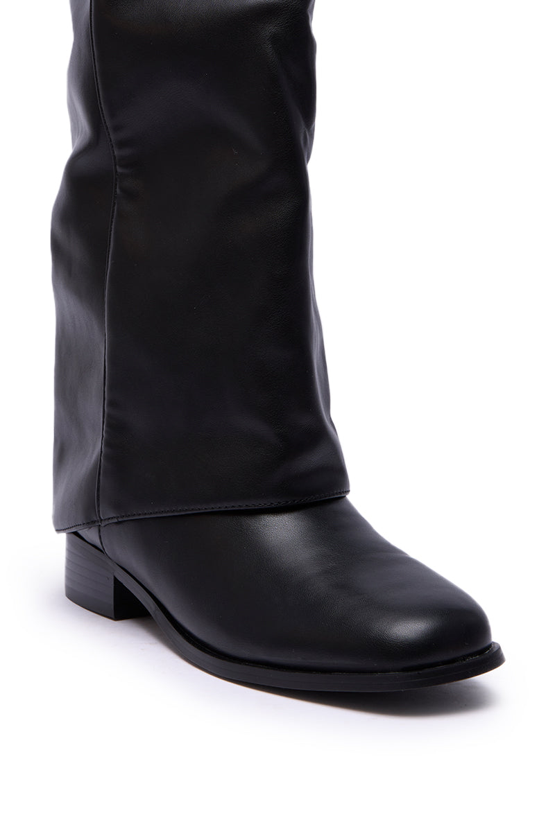 A close-up of the AZALEA WANG BRONTE Black Flat Knee High Riding Boot in faux leather, featuring a rounded toe and shown on a white background.