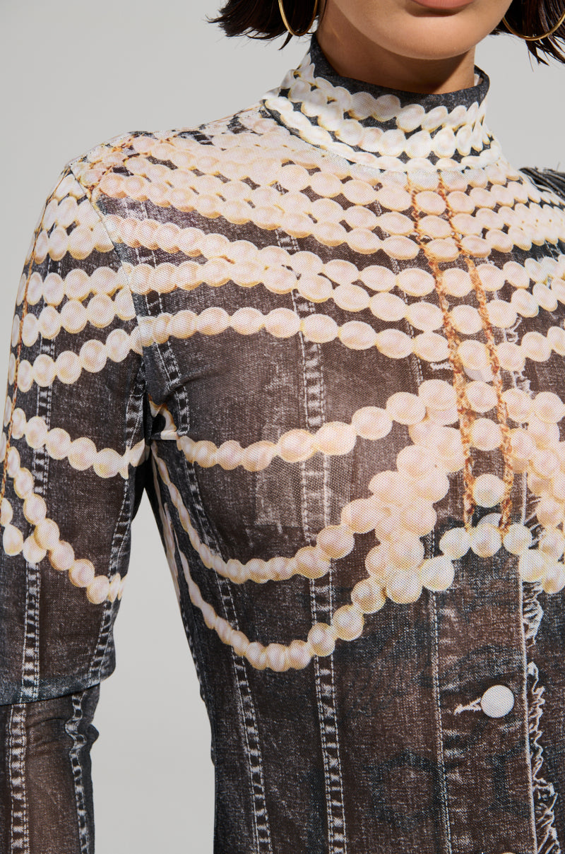A close-up of a garment with a high collar and patterned design in faux denim showcases printed pearl necklaces draped over sheer mesh shoulders and chest, resembling the intricate, layered look of the LOCKED IN BODYSUIT.