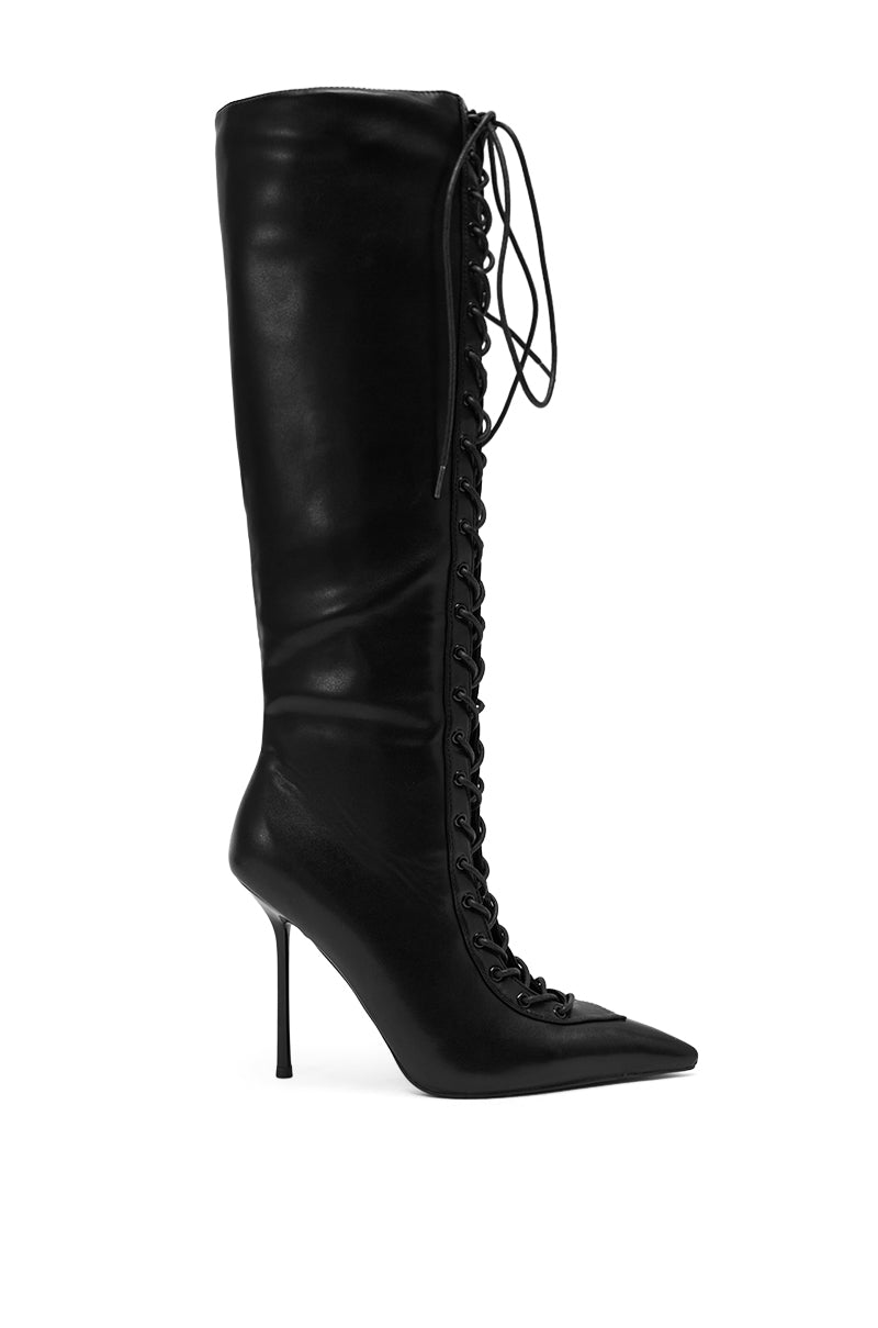 The AZALEA WANG BUCHANAN LACE UP BOOT IN BLACK is a knee-high leather boot with a pointed toe and high stiletto heel, offering an elegant, bold style. 5