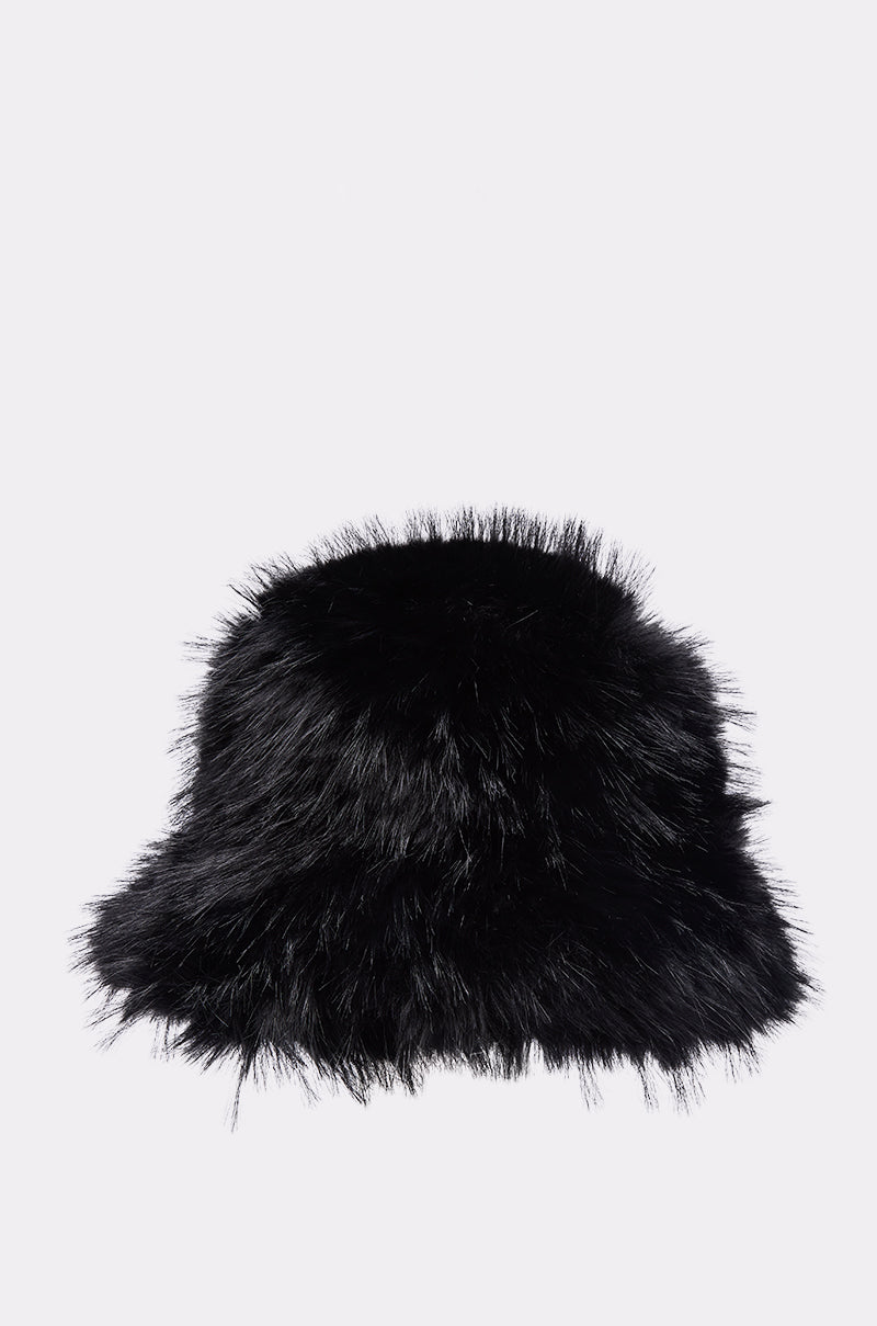 The CHIC FAUX FUR BUCKET HAT in black, with its soft and fluffy texture, is shown against a plain light gray background—a stylish winter accessory for warmth and fashion. 1