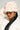 A person is wearing the TOASTIE FAUX FUR BUCKET HAT, a matching coat, and heart-shaped sunglasses. They have long black hair and silver hoop earrings.