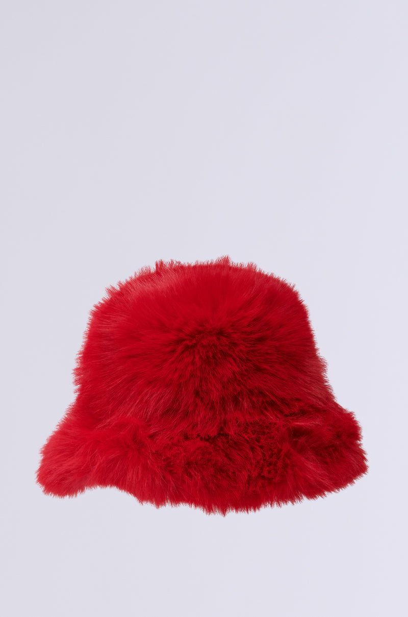 The LOOK AT ME NOW FAUX FUR HAT in vibrant red stands out against a plain light gray background, making it the perfect cold weather accessory. 3