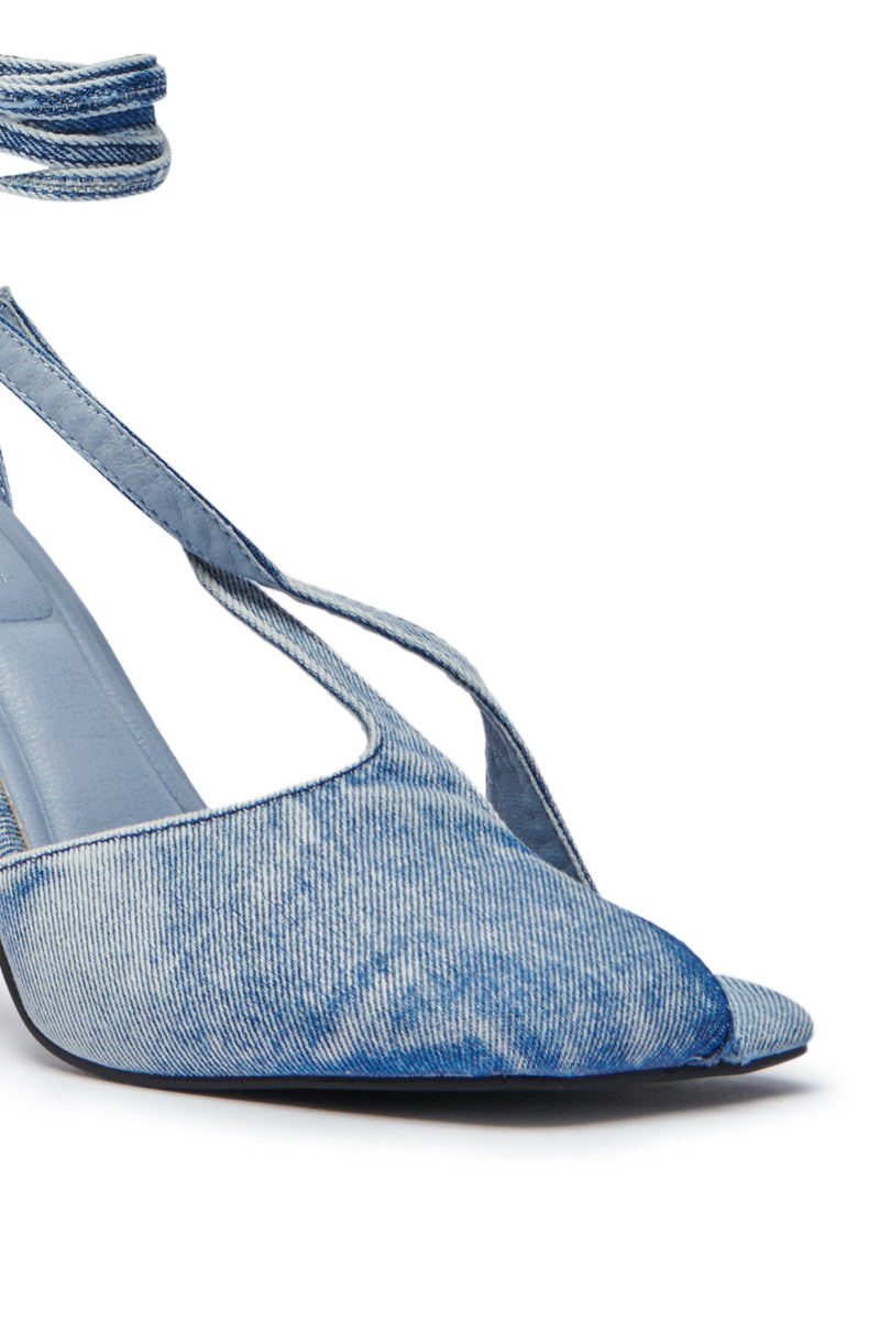 The AZALEA WANG BUIKY DENIM PUMP showcases a chic chunky heel, criss-cross straps, an open toe, and an ankle wrap detail in stylish denim.