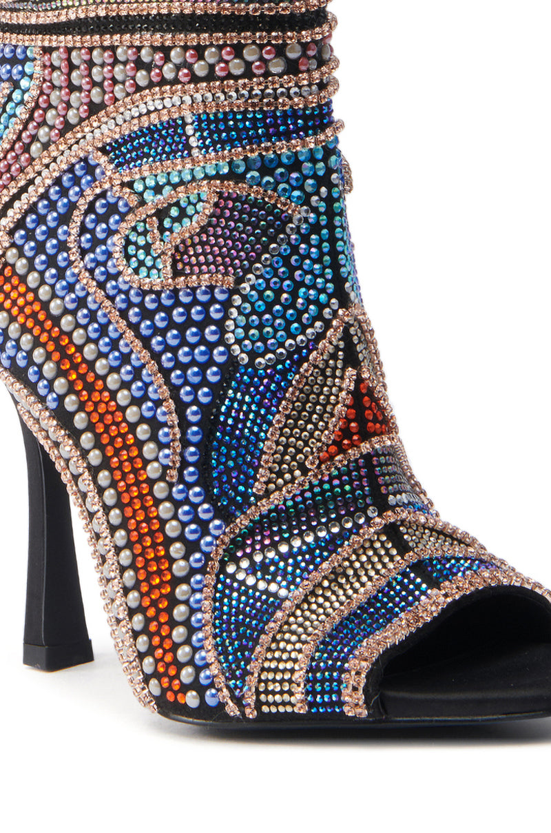 The AZALEA WANG BYRE BLACK EMBELLISHED RHINESTONE OPEN TOE BOOTIE redefines elegance with its intricate rhinestone patterns in blue, orange, purple, pink, and black swirls and geometric shapes on a sleek suede stiletto silhouette.
