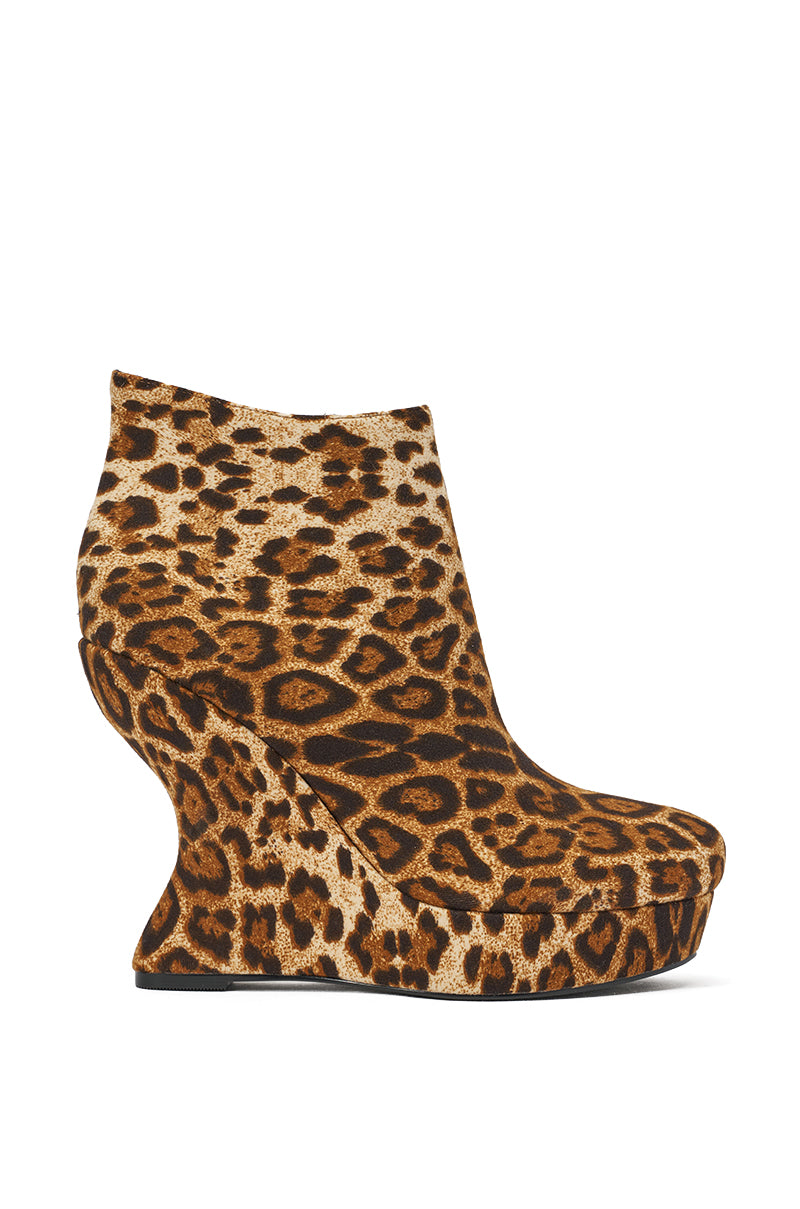 The AZALEA WANG CADY LEOPARD PRINT WEDGE BOOTIE is a luxe faux suede high-heeled bootie with bold leopard print and a sculptural curved platform sole for standout style. 3