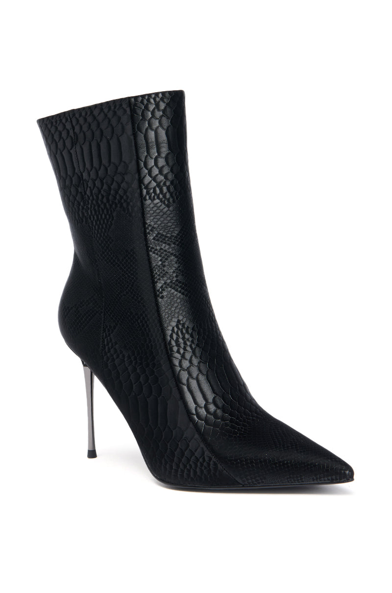 The AZALEA WANG CALEAN BLACK METAL STILETTO HEEL BOOTIE is a pointed-toe bootie in black faux snakeskin, featuring a sleek metal stiletto heel.