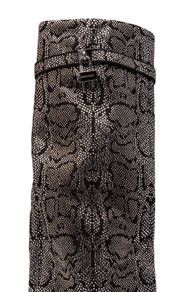 A close-up of the AZALEA WANG CAPRICORN Rhinestone Snake Pattern Wedge Fold Over Boot, tall in black and gray with a decorative strap and silver buckle near the top.
