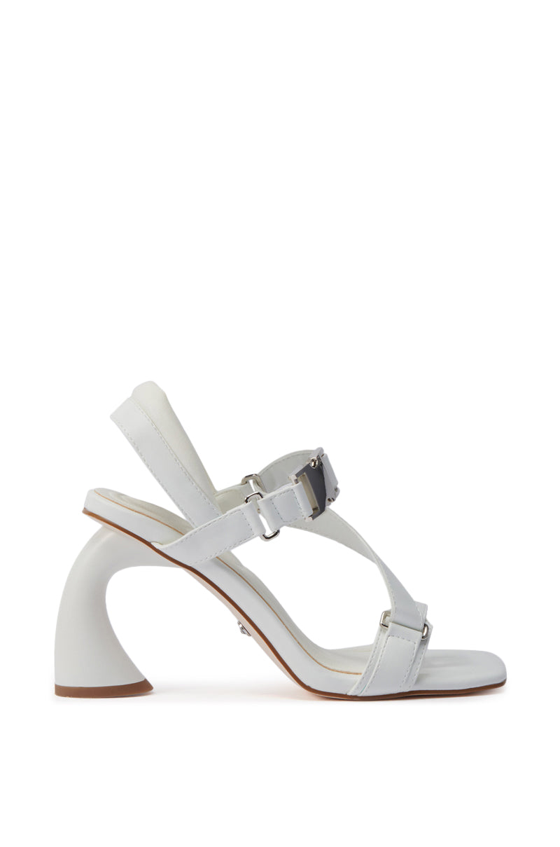The AZALEA WANG CAPRIZE WHITE INDUSTRIAL BUCKLE SANDAL features a stylish faux leather design, open square toe, adjustable ankle and front straps, curved block heel, and a light beige sole with a thin brown edge.
