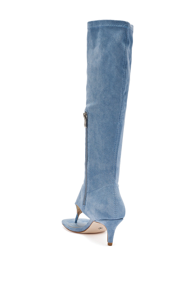The AZALEA WANG CECILE Light Blue Faux Suede Sandal features an open toe, side zipper, and low kitten heel in soft faux suede, shown knee-high and angled on a white background. 4