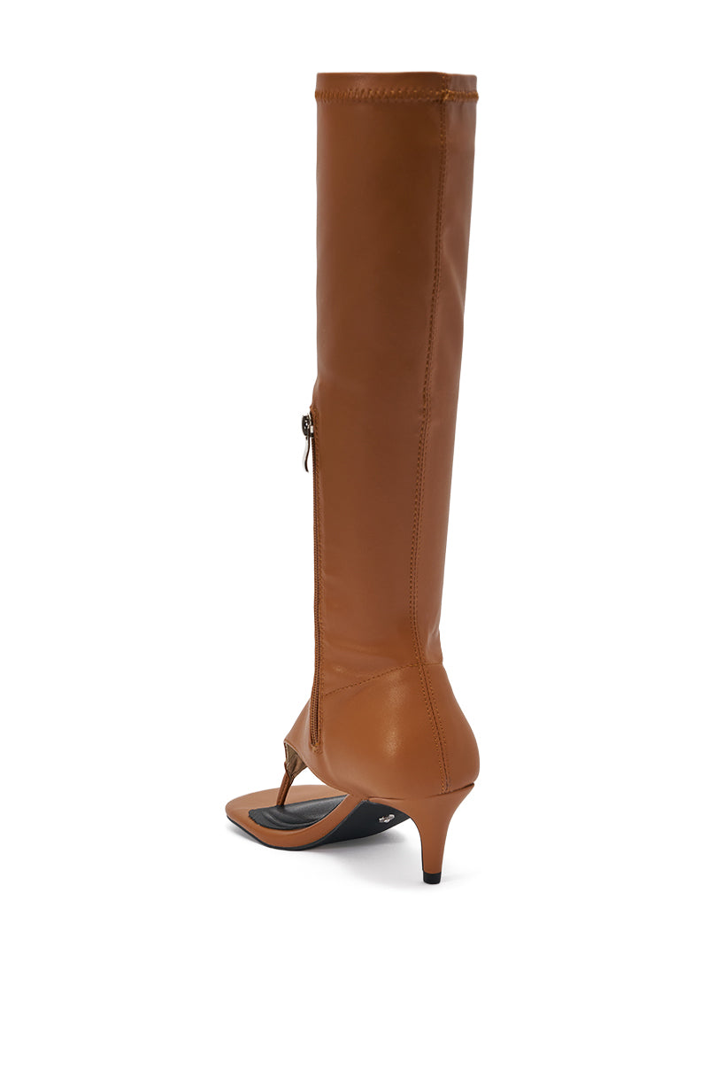 The AZALEA WANG CECILE TAN PU SANDAL is a brown, knee-high sandal with a pointed toe, low kitten heel, side zipper, smooth leather finish, and unique open toe design—combining elegance and modern flair. 5