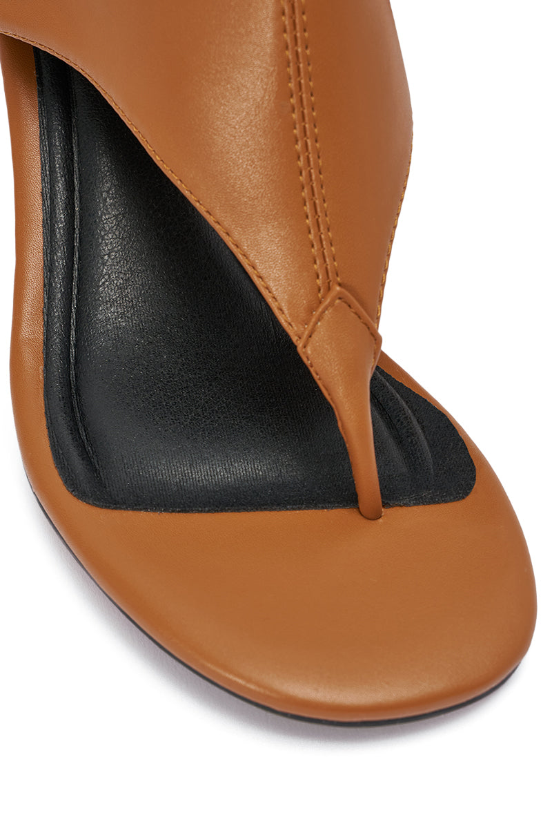 Close-up of the AZALEA WANG CECILE TAN PU SANDAL, featuring a tan PU finish, sleek stiletto heel, square black insole, and a chic thong toe strap design. 6