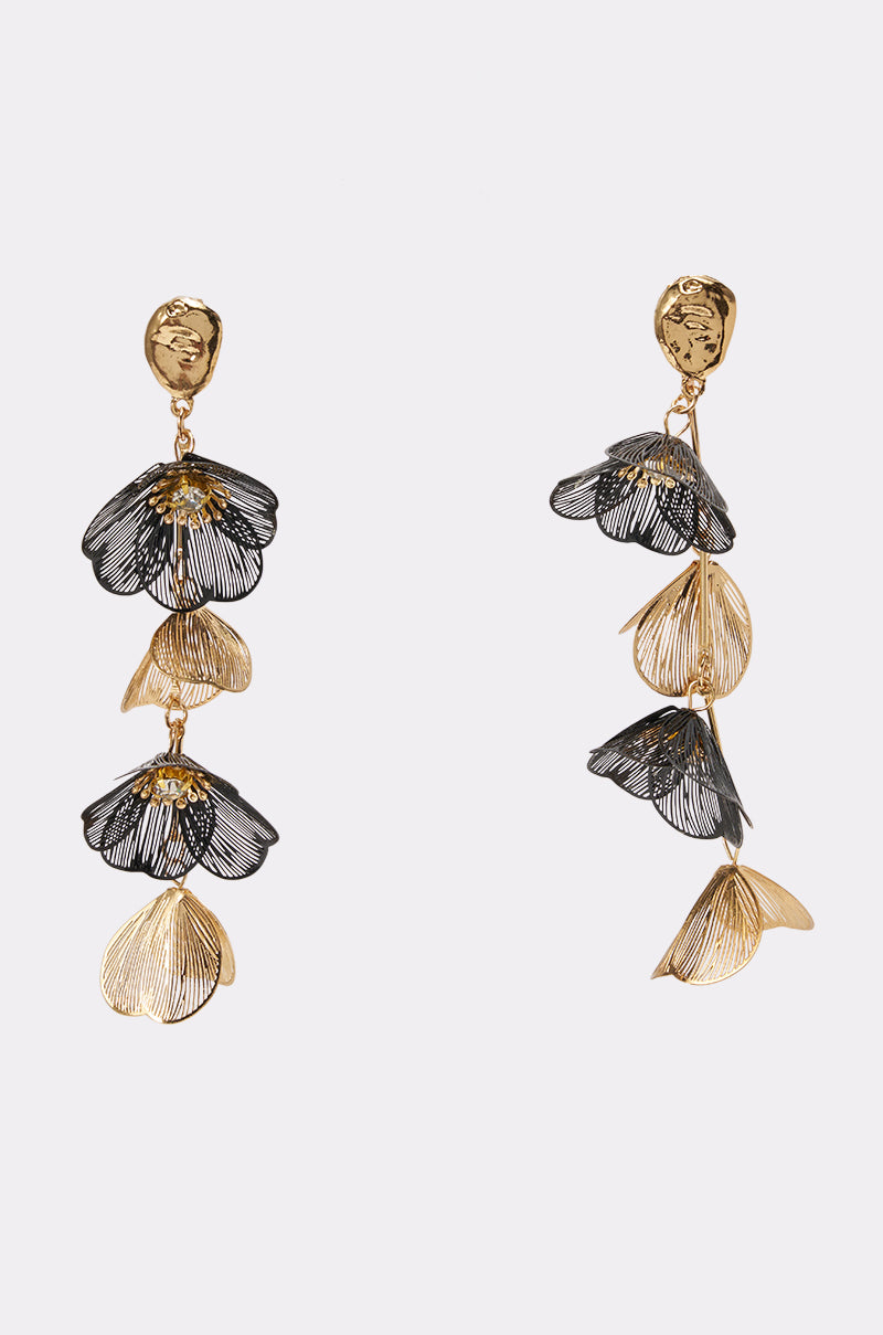 Introducing the TWO-TONE FLORAL DROP EARRINGS—a striking pair of asymmetrical statement earrings in gold and black, featuring textured gold floral studs and cascading, delicately layered flower petal designs. Perfect for elevating your look at any special occasion.