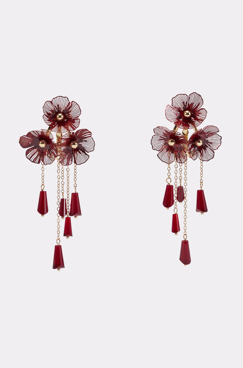 The BURGUNDY DRIP CHANDELIERS are formal earrings adorned with gold accents, delicate floral designs, and dangling burgundy beads and chains. Displayed against a plain white background, these chandelier earrings radiate elegance and sophistication, making them a standout accessory for any formal occasion.