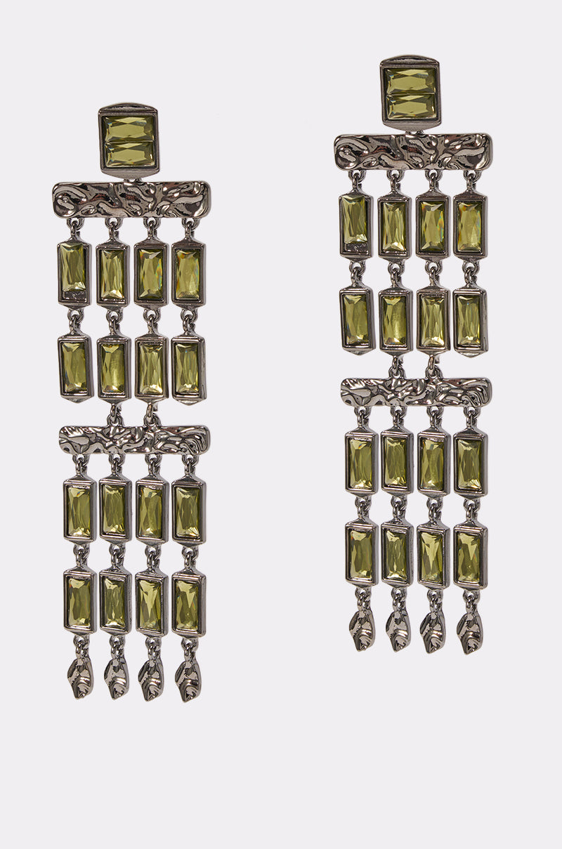 Introducing the BAGUETTE CHANDELIER EARRINGS IN GREEN: these striking chandelier earrings showcase three vertical rows of rectangular olive-green stones set in silver-toned metal, each row finishing with a delicate metallic accent.