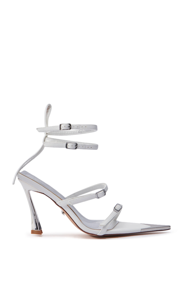 The AZALEA WANG CELESIA WHITE STILETTO SANDAL features a sleek, pointed toe with a clear strap design in faux leather. It boasts three adjustable straps, including an ankle strap, and is crafted with a thin stiletto heel for a modern and stylish look.