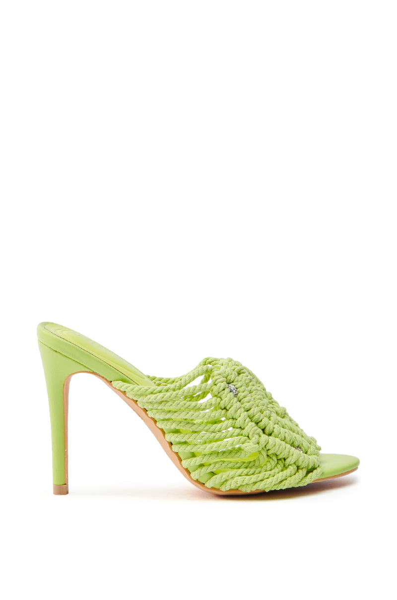 The AZALEA WANG CERES LIME ROPE WITH RHINESTONE BEADS SANDAL showcases a braided green design with rhinestone accents, featuring an open toe and slim stiletto heel on a neutral white background.