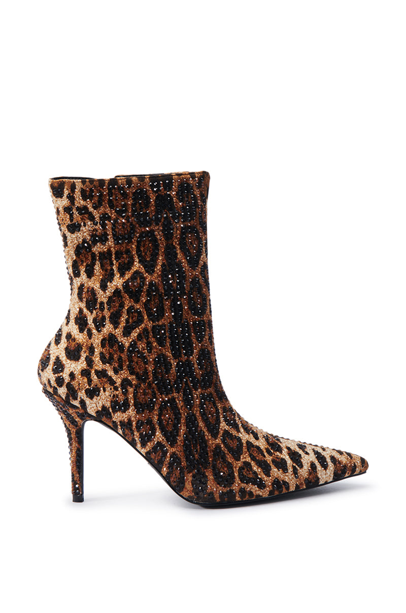 The AZALEA WANG CHAUNDRA LEOPARD EMBELLISHED STILETTO BOOTIE showcases a chic blend of leopard print and glittering details. Featuring a pointed toe and sleek stiletto heel, it creates a striking fashion impact, ideal for capturing attention. 3