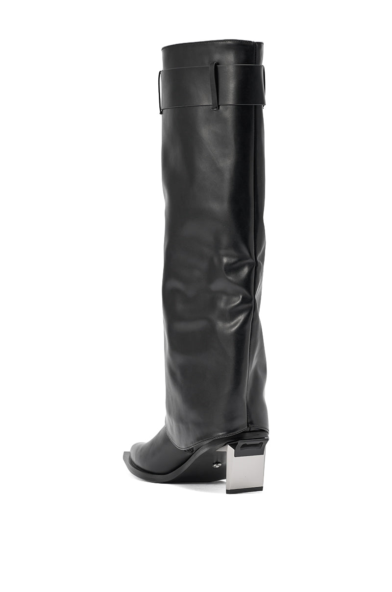 The AZALEA WANG CHRONO BLACK METAL HEEL BOOT is a tall, black faux leather knee-high boot with a loose slouchy shaft and chunky geometric metallic square heel, shown against a white background. 6