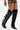 Someone wears the AZALEA WANG CINZIA BLACK CROC BUCKLE WEDGE BOOT in faux patent leather with multiple buckle straps, paired with black and gold lace-up shorts.