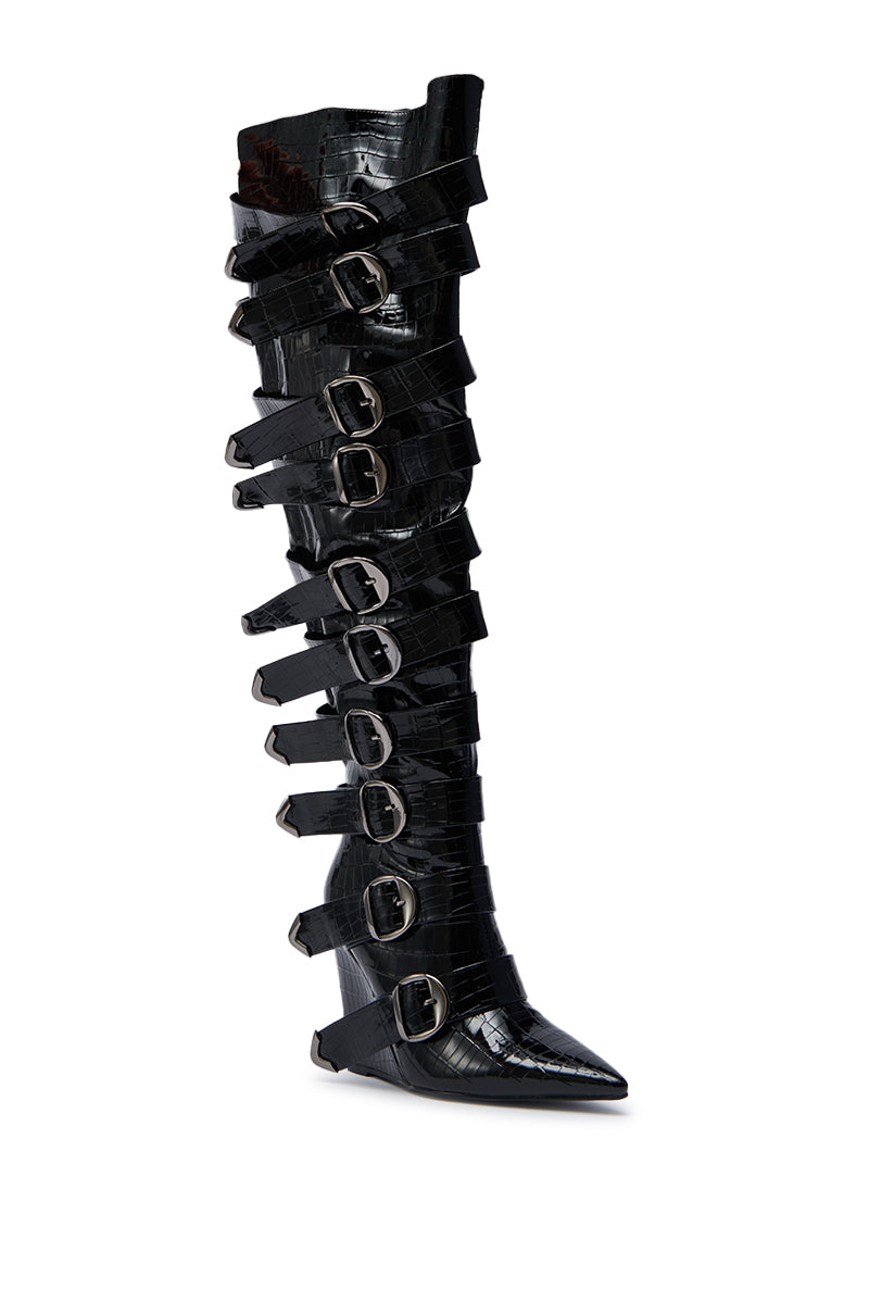 The AZALEA WANG CINZIA BLACK CROC BUCKLE WEDGE BOOT is a knee-high, glossy black crocodile-textured wedge boot featuring nine horizontal buckle straps along its length.