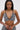A woman with long, straight dark hair wears the SHAGGY BRALETTE and matching bottoms, featuring textured fabric, posed against a plain light background.