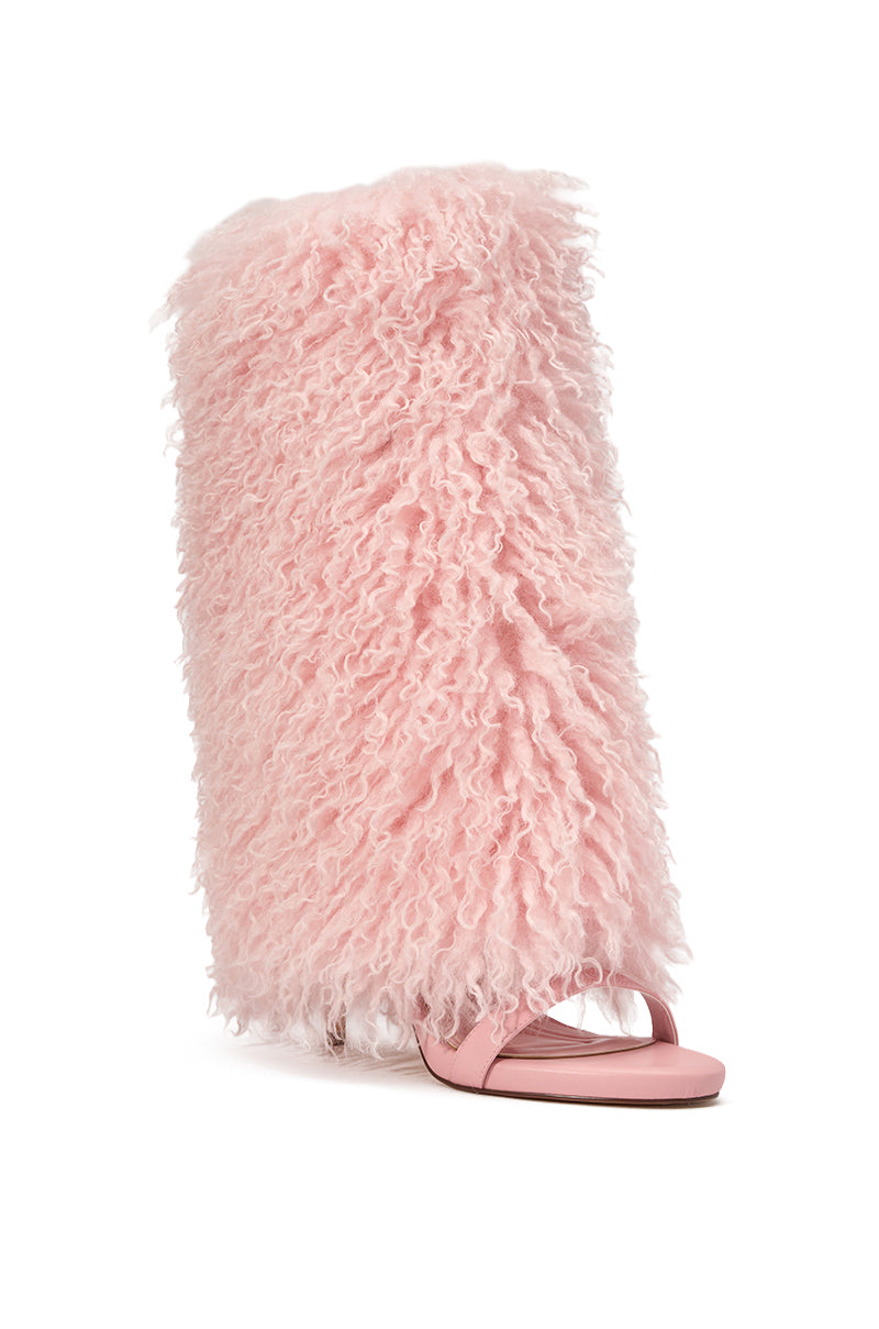 The AZALEA WANG CLOUD NINE PINK FUR OPEN TOE BOOT features a baby pink stiletto design with oversized fluffy faux fur that extends up the leg, combining the boldness of knee-high foldover boots with playful texture. 3